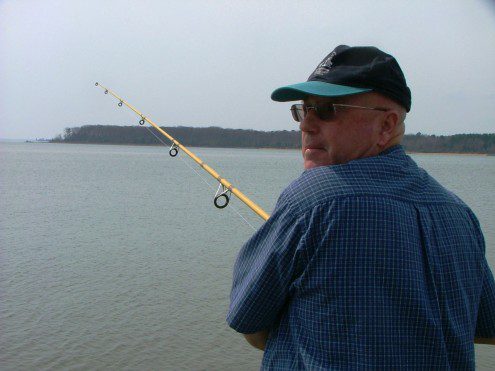Jarboe, Capn Larry fishing with St. Clements Island in background Jarboe, Capn Larry fishing with St. Clements Island in background
