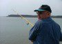 Jarboe, Capn Larry fishing with St. Clements Island in background