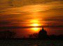 St. Clement's Island with the sun setting behind the Blackiston Lighthouse.  Copyright 2010 THE CHESAPEAKE