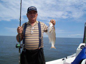 Buddy Scala with a fine croaker. Photo for The Chesapeake Today by Steve Scala