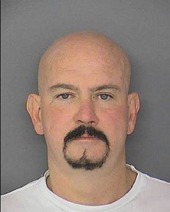 Usually one step ahead of the law, Eddie Keister appears glum in this publicity photo. 