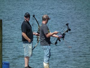 Bow fishing from the bow for skates and snakeheads.  THE CHESAPEAKE TODAY photo