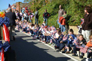 Children show their patriotism and respect for veterans at the annual Veterans Day Parade in Leonardtown. Photo by Tiffany Barthelme for THE CHESAPEAKE TODAY