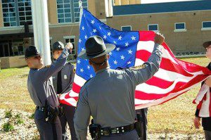 Virginia State Police raise the U. S. flag. 