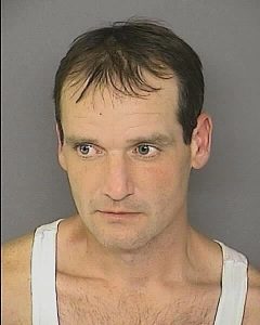 Martin Abell under arrest for theft of TV.