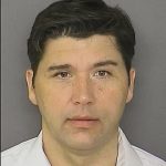 Shawn Morgan under arrest for violating court order.