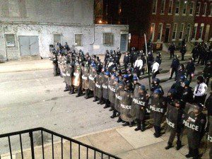 Baltimore Police face off with thugs breaking windows and damaging police cars but were ordered to stand down and not prevent looting.