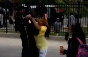 Mother slams her kid and drags him off the streets as riot starts in Baltimore