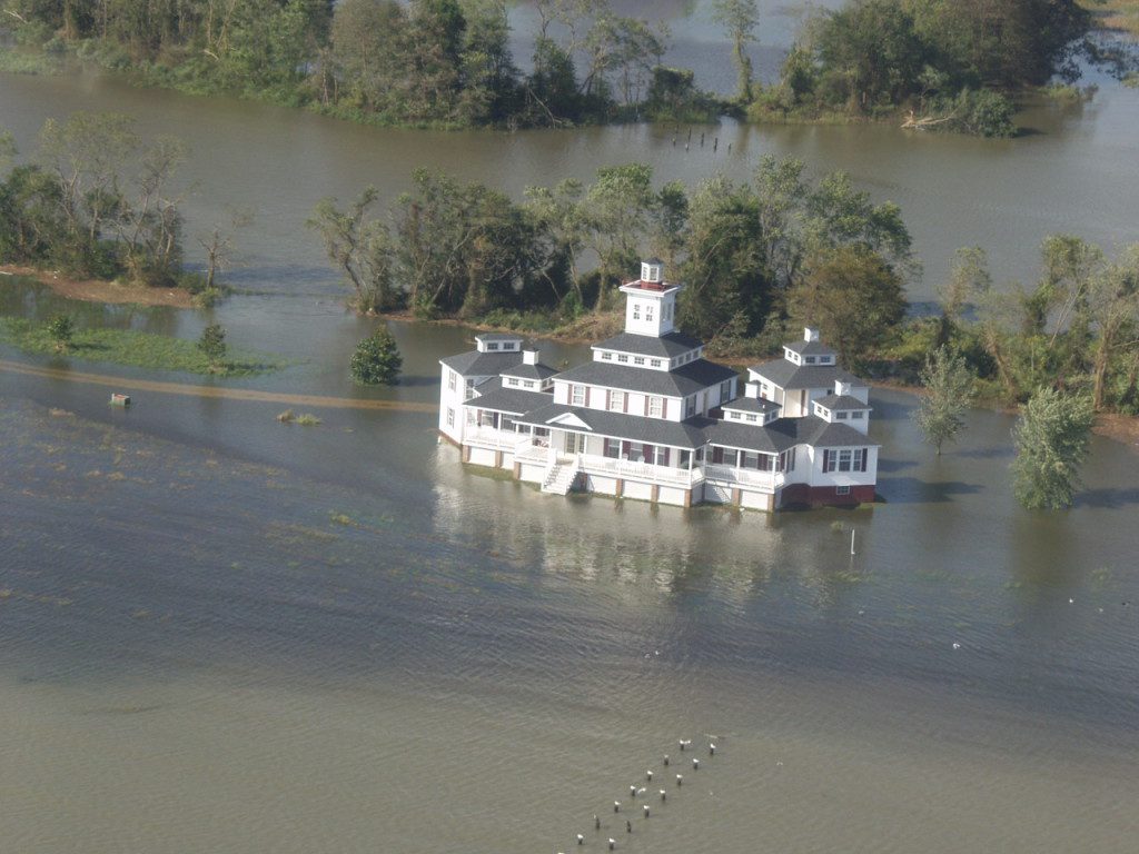 The owner of this rambling riverfront home might want to name it "River House" with boat parking underneath. 