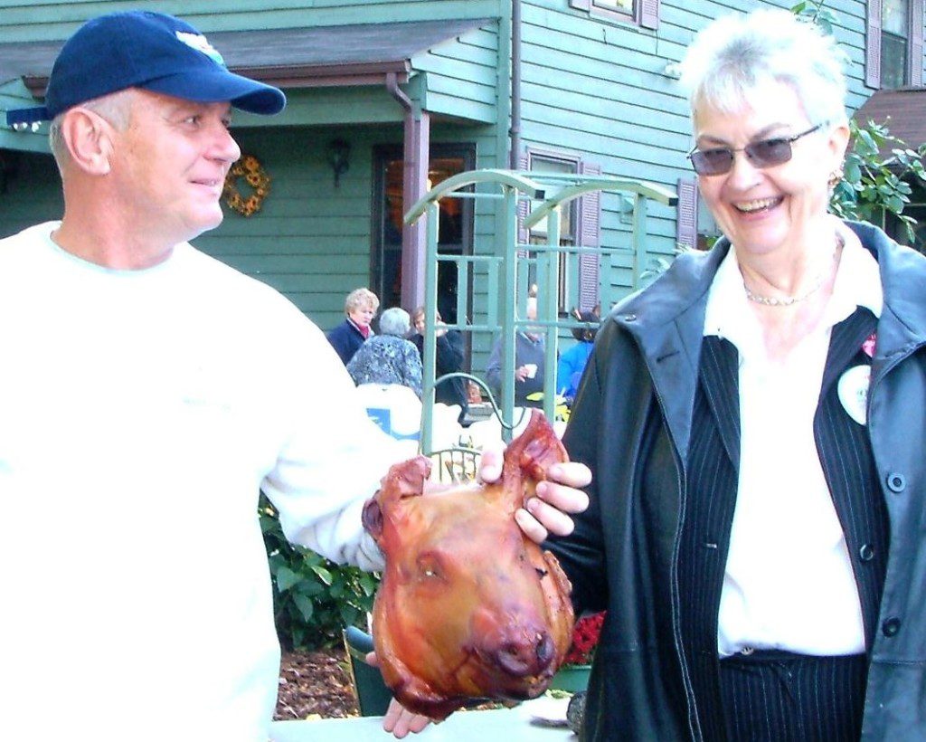 Clare Whitbeck embraced all facets of politics in order to further her goals, including posing with pigs and politicians, such as her friend St. Mary's County Commissioner Dan Morris.  THE CHESAPEAKE TODAY photo