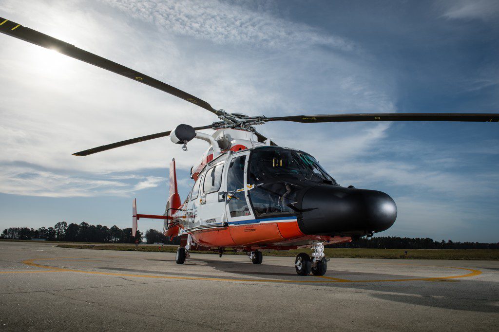 Coast Guard Jayhawk Helicopters stand ready at Air Station Elizabeth City Wednesday, March 10, 2016. Air Station Elizabeth City helicopter crews were at Kill Devil Hills to celebrate the centennial anniversary of the Coast Guard's aviation program with formation flights and a classic painting scheme. (U.S. Coast Guard photo illustration by Auxiliarist David Lau)