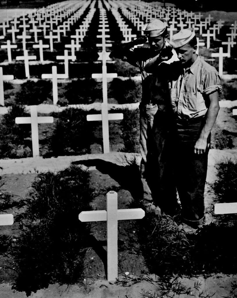 Coast Guardsmen pay silent homage to the memory of a fellow Coast Guardsman killed in Ryukyu Islands.