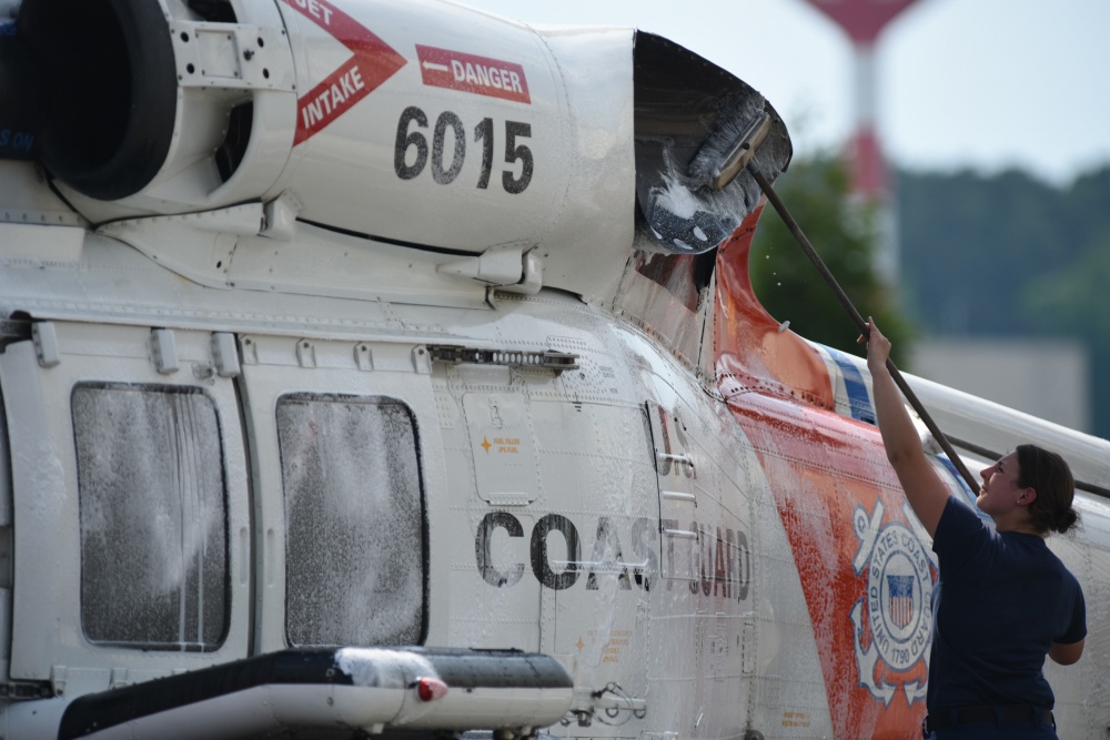 Over at Air Station Elizabeth City, Petty Officer 3rd Class Monique Pluard scrubs a MH-60 Jayhawk Monday, June 13, 2016. Constant maintanence and upkeep help air station crews remain mission ready at all times. US COAST GUARD ELIZABETH CITY, NC, UNITED STATES