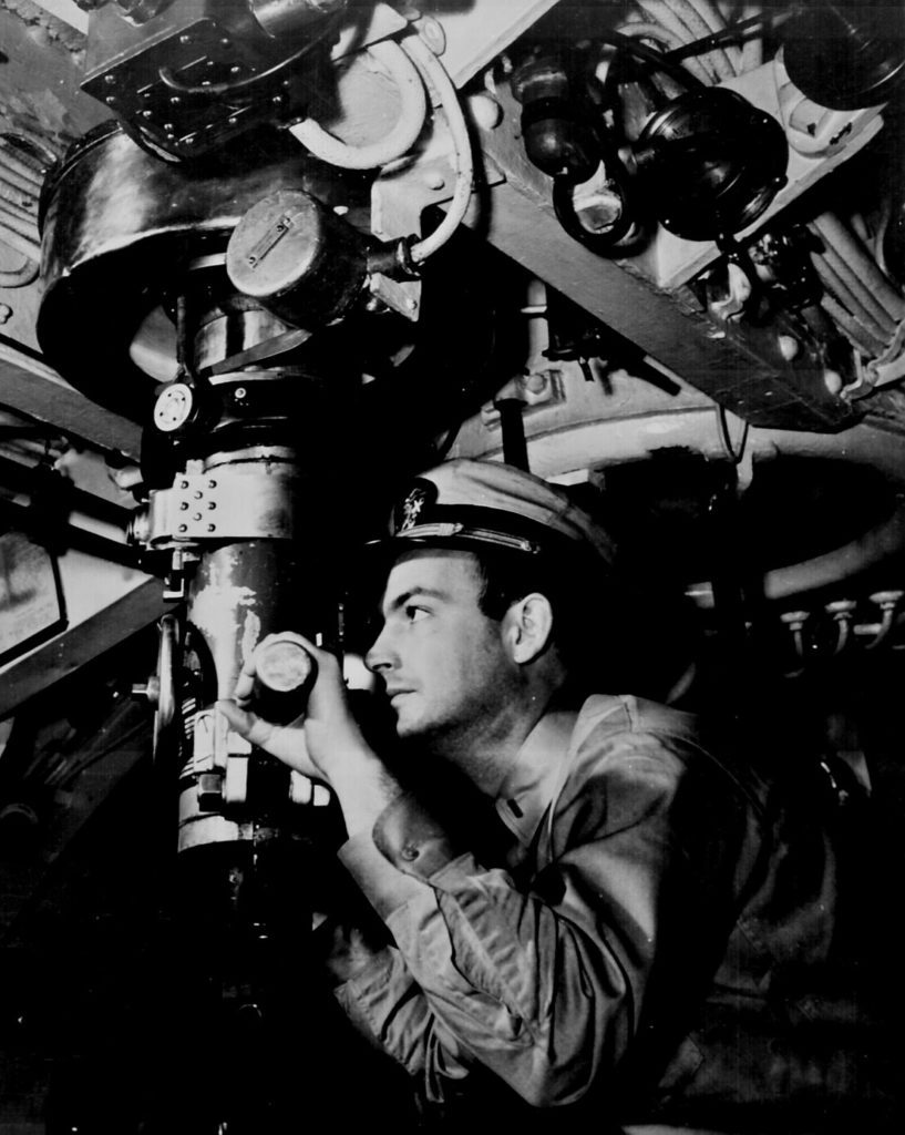 U. S. Naval Officer at periscope in control room of submarine. Ca. 1942. 80-G-11258.